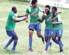  ??  ?? Jourdaine Fletcher (right) celebratin­g his debut goal with his Montego Bay United teammates in their 2-1 win over Waterhouse FC in the Red Stripe Premier League at Wespow Park in Montego Bay, St James, on Sunday, January 8, 2017.