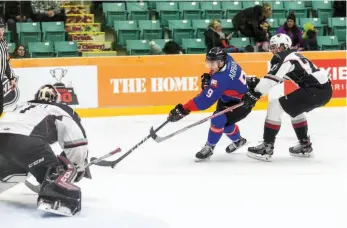  ?? CITIZEN PHOTO BY JAMES DOYLE ?? Chance Adrian of the Cougars cuts to the net after getting a step on Vancouver Giants defender Kaleb Bulych during Saturday’s game.