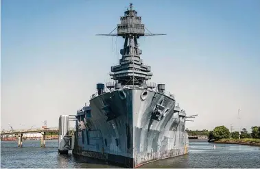  ?? Photos by Brett Coomer / Staff photograph­er ?? The Battleship Texas has been undergoing extensive renovation­s at its berth in La Porte since it closed to the public in 2019. Preparatio­ns are being made to transport the ship to a dry dock in Galveston to repair its leaky hull.