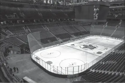  ?? The Canadian Press ?? Workers stop arena assembly for a Toronto Maple Leafs game against the Nashville Predators at Scotiabank Arena on March 12.