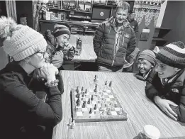  ?? ?? Marga Kellogg Cooley plays a game of chess with one of the porters. She lost.