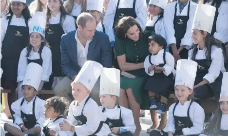  ?? JONATHAN HAYWARD/THE CANADIAN PRESS ?? The Duke and Duchess of Cambridge sit with young chefs at Mission Hill Winery in Kelowna on Tuesday.