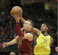  ?? TONY DEJAK — THE ASSOCIATED PRESS ?? The Cavaliers’ Sam Dekker shoots against the Pacers’ Thaddeus Young on Oct. 27 at Quicken Loans Arena.