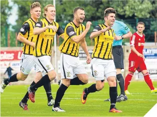  ??  ?? Delight for East Fife goalscorer Kevin Smith (second right).