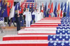  ?? SUSAN WALSH/ASSOCIATED PRESS ?? Vice President Mike Pence, left, attends a ceremony marking the arrival of war remains believed to be of American service members at Joint Base Pearl Harbor-Hickam, Hawaii, Wednesday.