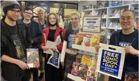  ?? Picture: Phil Creighton ?? GREAT NEWS FOR ALL READERS: Customers with the Crunch Comics team celebratin­g Free Comic Book Day last year
