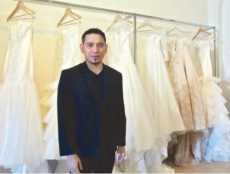  ??  ?? Internatio­nally acclaimed fashion designer John Herrera opens Louvre-inspired boutique offering off-the-rack bridal and evening wear at Shangri-La Plaza.