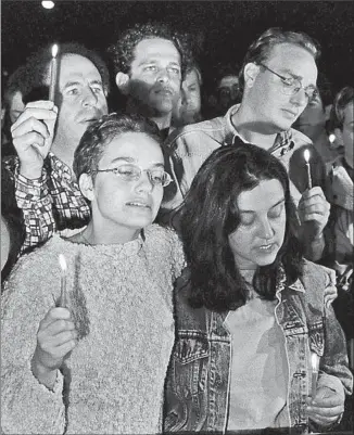  ?? Eyal Warshavsky
Associated Press ?? ISRAELIS HOLD a candleligh­t vigil outside Ichilov hospital in Tel Aviv, where Prime Minister Yitzhak Rabin was taken after being shot by a Jewish extremist at a peace rally on Nov. 4, 1995.