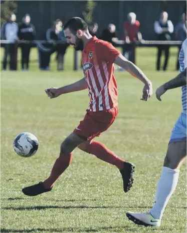  ??  ?? Ryhope CW striker Josh Home-Jackson lines up a shot in Saturday’s 2-1 defeat at home to South Shields