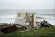  ?? CARLOS GIUSTI — THE ASSOCIATED PRESS ?? A ruined house is seen Thursday in El Negro community a day after the impact of Hurricane Maria, in Puerto Rico.