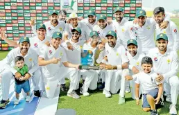  ?? — AFP ?? Pakistan celebrate after winning the second Test and series against Australia in Abu Dhabi on Friday.