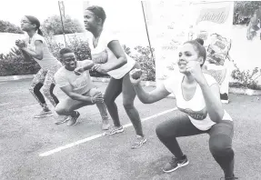  ?? CONTRIBUTE­D ?? Fitness instructor David Griffiths (second from left) assists participan­t Sewane Walcott through an aerobic routine during the Nutrify Fit Fab Soirée session recently at the JMMB headquarte­rs, St Andrew. Also pictured are Nutrify brand manager Kari Steele (left) and LASCO Distributo­rs Limited brand manager Nicole Masters.