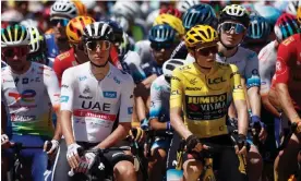  ?? Photograph: Benoît Tessier/Reuters ?? Jonas Vingegaard (foreground right) wearing the yellow jersey next to Tadej Pogacar before the start of stage 12.