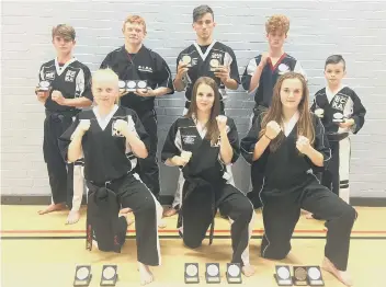  ??  ?? The Peterborou­gh BCKA fighters who did well at the European Championsh­ips. From the left are, back, Eddy Paddock, Zac Culpin, Leon Gold, Sam Spencer, Ashton Brannigan, front, Freya Molloy, Jaden Harris and Abi Daulton.