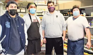  ?? Cassandra Day / Hearst Connecticu­t Media ?? From left are members of the Morris family — Matt, Tom, owner Josh and their father Victor — at Public Market on Main Street in Middletown. Josh Morris made the difficult decision this week to close up shop after being unable to find a buyer for the 106-year-old small business formerly run by the Passacanta­ndo family.