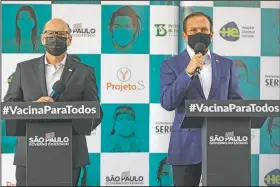  ??  ?? Sao Paulo Governor Joao Doria (right) and Butantan Institute Director Dimas Covas give a news conference at a vaccinatio­n center set up inside a public school in Serrana.