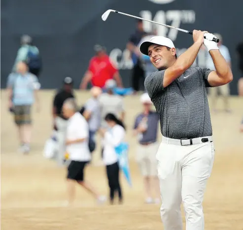 ?? PETER MORRISON / THE ASSOCIATED PRESS ?? Francesco Molinari of Italy withstood any number of challenger­s during a wild and crazy final round at the British Open before winning by two strokes at Carnoustie, Scotland on Sunday.