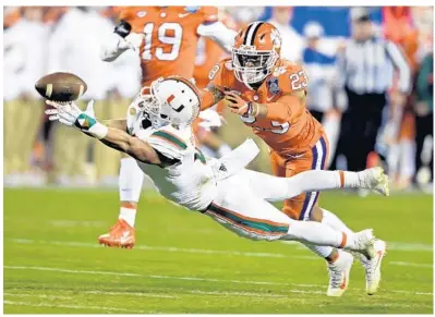  ?? MIKE MCCARN/AP ?? Braxton Berrios doesn’t understand why some NFL scouts are questionin­g his love for football. UM coach Mark Richt said there’s no question about his passion to the sport. “If you watched him play in the [FSU] game, you know he’s committed to football,”...