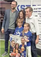  ?? GREGG DOYEL/INDYSTAR ?? Andrew Luck poses with Angie and Brian Elliott and their children.