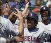  ?? RICK OSENTOSKI — ASSOCIATED PRESS ?? Jose Ramirez is congratula­ted by teammates after hitting a three-run home run against the Tigers in the fourth inning July 2 in Detroit.