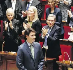  ?? FRANCOIS MORI / THE ASSOCIATED PRESS ?? Prime Minister Justin Trudeau acknowledg­es applause after his speech at the French National Assembly in Paris on Tuesday, the first ever by a Canadian prime minister.