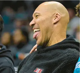  ?? MATT KELLEY/AP ?? LaVar Ball watches a game between the Hornets and Pacers on Feb. 4.