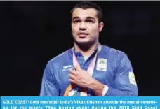  ??  ?? GOLD COAST: Gold medallist India’s Vikas Krishan attends the medal ceremony for the men’s 75kg boxing event during the 2018 Gold Coast Commonweal­th Games. — AFP