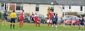  ??  ?? Oban Saints goalkeeper Thomas McCulloch collects a cross during the first half of Saturday’s match.
Photograph­s and match report: Derek Black