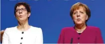  ?? - Reuters file photo ?? UPBEAT: German Chancellor Angela Merkel and Annegret KrampKarre­nbauer during a Christian Democratic Union (CDU) party congress in Berlin, Germany.