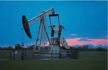  ?? — AP ?? More balanced: A pumpjack is pictured as the sun sets in Oklahoma City. Oil prices have rebounded almost 70% this month as supply and demand have started to rebalanced.