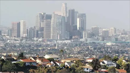  ?? Photograph­s by Luis Sinco Los Angeles Times ?? THE DOWNTOWN L.A. skyline has changed constantly since it began to grow more vertical with the rise of skyscraper­s in the 1960s.