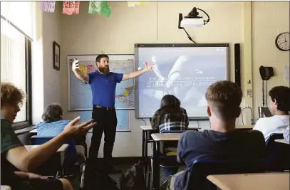  ?? H John Voorhees III / Hearst Connecticu­t Media ?? Mike Nolan, a Shepaug Valley School teacher, works with his Spanish 3 class Monday morning. Nolan has received the CEA Above and Beyond the Call of Duty Award for his extraordin­ary efforts to assist English learners and their Families.