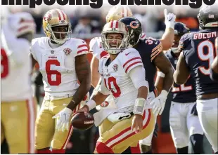  ?? Armando L. Sanchez
/TNS ?? 49ers quarterbac­k Jimmy Garoppolo celebrates after running in a touchdown during the fourth quarter against the Bears at Soldier Field on Sunday.