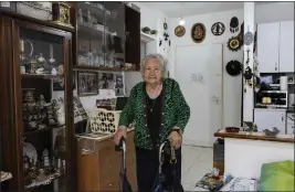  ?? TSAFRIR ABAYOV — THE ASSOCIATED PRESS ?? Holocaust survivor Tova Gutstein, 90, who lived in the Warsaw Ghetto as a child, is seen at her apartment in the city of Rishon Lezion, Israel, on April 9. Gutstein was a child when the Nazis put down the Warsaw Ghetto Uprising.