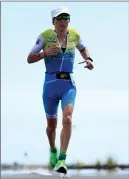  ??  ?? Ironman triathlete David McNamee trains in Girona