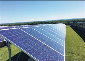  ?? Luther Turmelle / Hearst Connecticu­t Media ?? A 2014 photo of solar panels located on top of Hartford's North Meadows landfill. The Hartford landfill projects has nearly 4,000 photovolta­ic panels that trun sunlight into electricit­y.