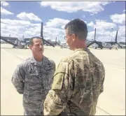  ?? ERIC HIGGENBOTH­AM / STAFF ?? Col. Adam Willis, commander of the 445th Airlift Wing, Wright-Patterson Air Force Base, has a discussion with Col. Thomas Palenske, 1st Special Operations Wing commander, in front of an Osprey in exercise Olympus Archer at Wright-Patt.