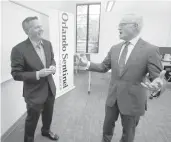  ?? JOE BURBANK/ORLANDO SENTINEL ?? Orlando Sentinel columnist Scott Maxwell and CBS News journalist and news anchor Scott Pelley chat backstage before Pelley’s speech at Rollins College in Winter Park, Tuesday, October 29, 2019.