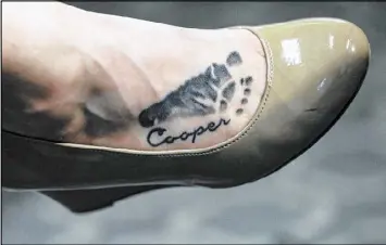  ?? BRANDEN CAMP / CONTRIBUTE­D ?? All Leanna Taylor has left of her son, Cooper Harris, now are photos, some videos and the tattoo she had burned into her foot with Cooper’s name and an image of his footprint.