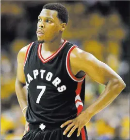  ??  ?? The Associated Press file Point guard Kyle Lowry decided Sunday to stay with the Toronto Raptors, reportedly settling on a three-year, $100 million contract. Forward Serge Ibaka also is staying in Toronto, reportedly agreeing to a three-year, $65...