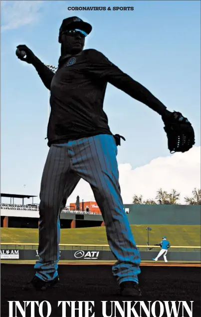  ?? JOSE M. OSORIO/CHICAGO TRIBUNE ?? Cubs shortstop Javier Baez tosses the ball during batting practice during February’s spring training. Five months later, players are returning to workouts.