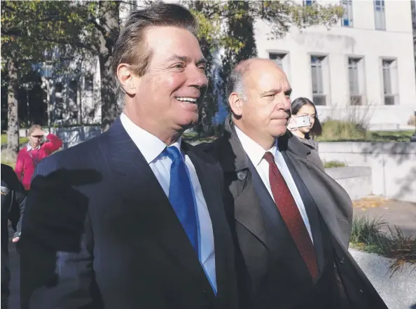  ?? Picture: AP ?? UNDER ARREST: Paul Manafort, left, leaves Federal District Court in Washington on Monday. Manafort and his business associate Rick Gates have pleaded not guilty to felony charges of conspiracy against the United States and other counts.