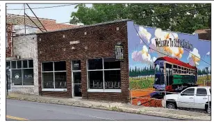  ?? Arkansas Democrat-Gazette/ERIC E. HARRISON Stone’s Throw Brewing is set to open its Stifft Station pub — with its brand new streetcar mural — next week. ??