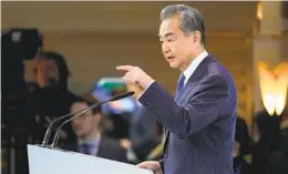  ?? PETR DAVID JOSEK AP PHOTOS ?? Wang Yi, the Chinese Communist Party’s most senior foreign policy official, speaks at the Munich Security Conference on Saturday.