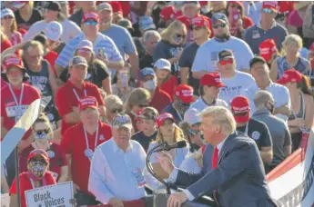  ?? MANDEL NGAN/AFP VIA GETTY IMAGES ?? President Donald Trump speaks during a rally at Tucson Internatio­nal Airport in Tucson, Arizona, on Monday, his fifth rally in three days.