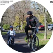  ?? PHOTO BY MICHILEA PATTERSON – FOR MEDIANEWS GROUP ?? A man and a little boy have a group ride on the Schuylkill River Trail at Pottstown Riverfront Park.