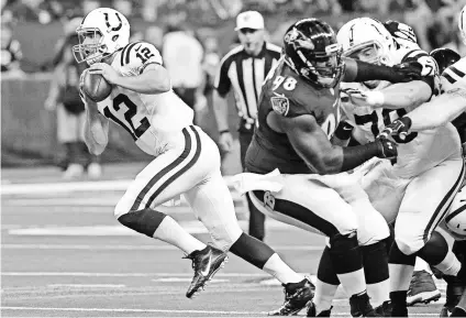  ?? THOMAS J. RUSSO, USA TODAY SPORTS ?? Colts quarterbac­k Andrew Luck, left, made his preseason debut against the Ravens on Saturday and completed all eight of his passes for 71 yards on two possession­s.