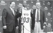  ?? GETTY IMAGES/FILE ?? Randy Pfund, Dwyane Wade and Pat Riley attend a press conference to present the Heat’s 2003 draft pick.