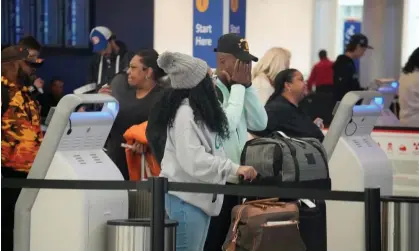  ?? Photograph: David Zalubowski/ AP ?? Travelers line up to check in at Denver Internatio­nal Airport on 20 November 2023, in Denver, Colorado.