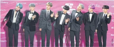  ??  ?? BTS, also known as the Bangtan Boys, pose on the red carpet at the 28th Seoul Music Awards.